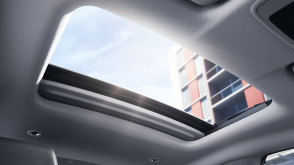 Interior view of open power moonroof letting in sunlight.