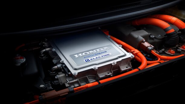 Closeup of a Honda Earth Dreams Fuel Cell engine under open hood of car.