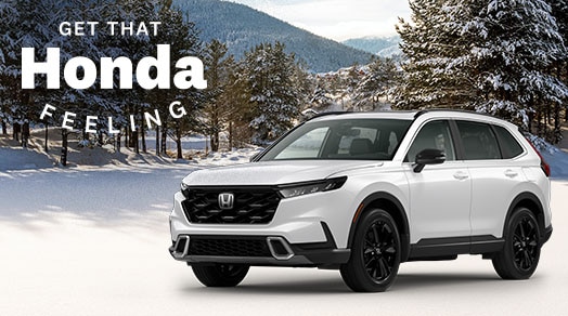 Honda vehicle on forest in winter background. Get That Honda Feeling logo tag placed on top left.