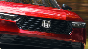 Closeup of front grille on a red Accord. 