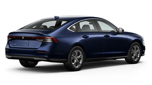 ¾ driver side rear facing view of 2023 Accord Touring Hybrid model in Canyon River Blue Metallic colour