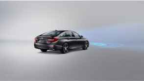3/4 rear view of grey Accord on white space. Blue sensor lines and waves emit from the front. 