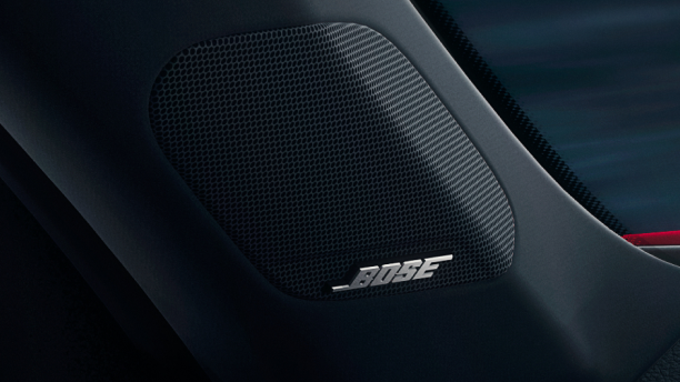 Close up of tweeter speaker that reads: “BOSE”.