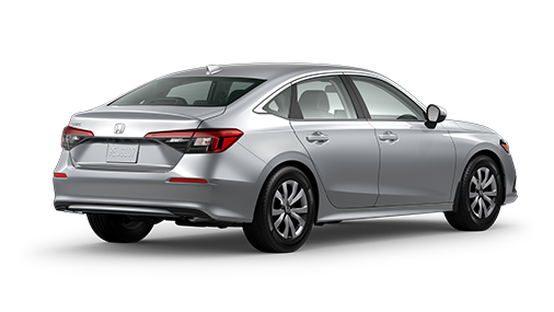 ¾ driver side rear facing view of 2023 Civic Sedan LX model in Lunar Silver Metallic colour