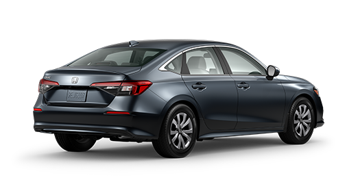 ¾ driver side rear facing view of 2023 Civic Sedan LX model in Meteoroid Gray Metallic colour