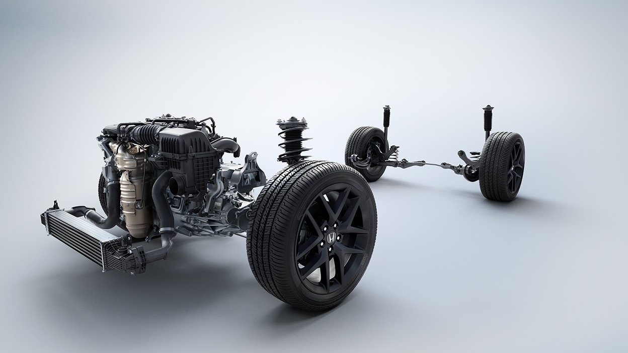 View of engine, suspension system, and tires on white space.