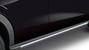 Closeup of metallic grey side lower trim at the bottom of the door on a black HR-V