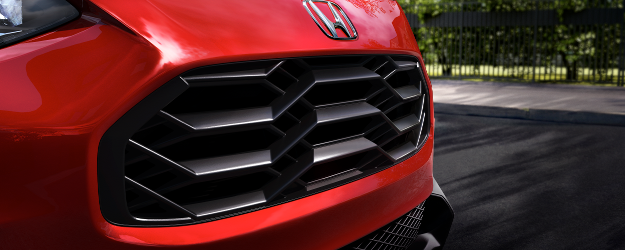 Closeup of grille on red HR-V.
