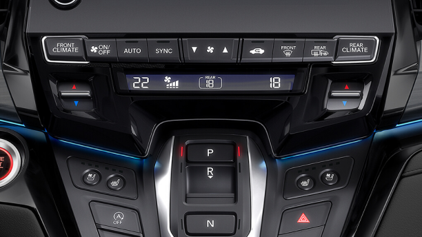 Closeup of centre console with heated seat buttons.