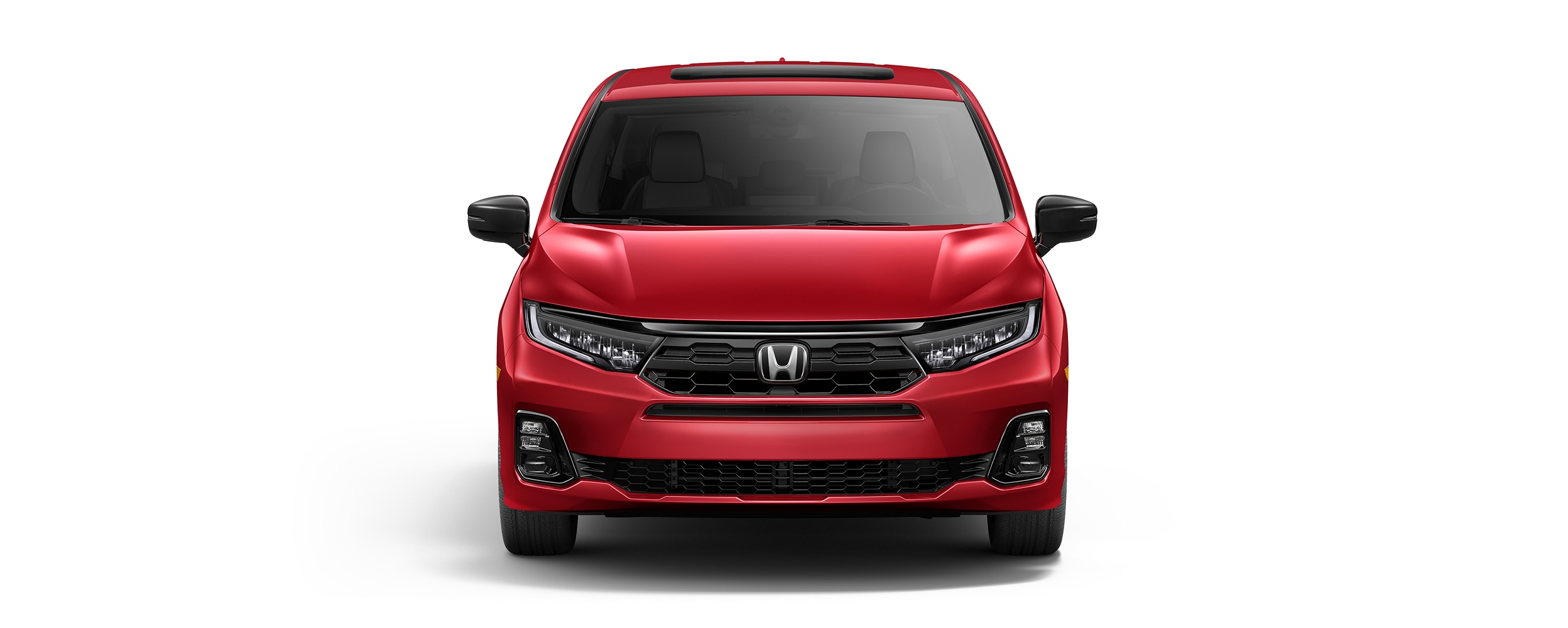 Vue avant étendue d’une Odyssey rouge sur fond blanc.