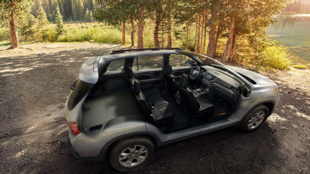 3/4 bird’s eye view of grey honda Passport showing the rows of seating and cargo space.