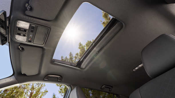 Interior worm’s eye view of open moonroof.