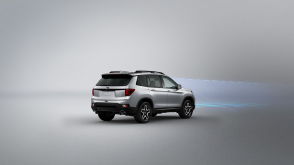 3/4 rear view of grey Passport. Blue sensor waves and lines emit from the front.