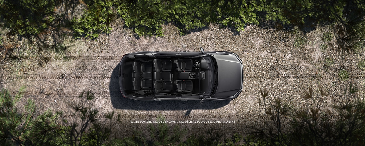 Bird’s eye view of Pilot on dirt road with now roof, showcasing all its seating. 
