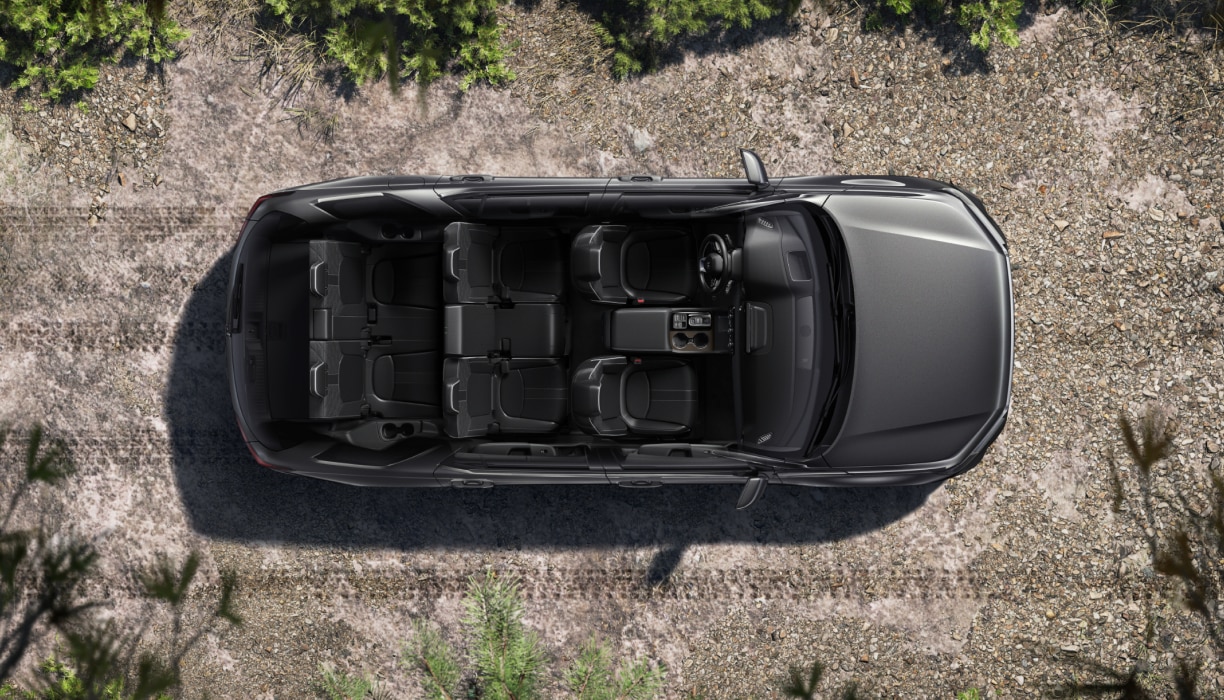 Vue de dessus d’un Pilot gris dont le toit a été enlevé, révélant la disposition des sièges pour sept personnes.