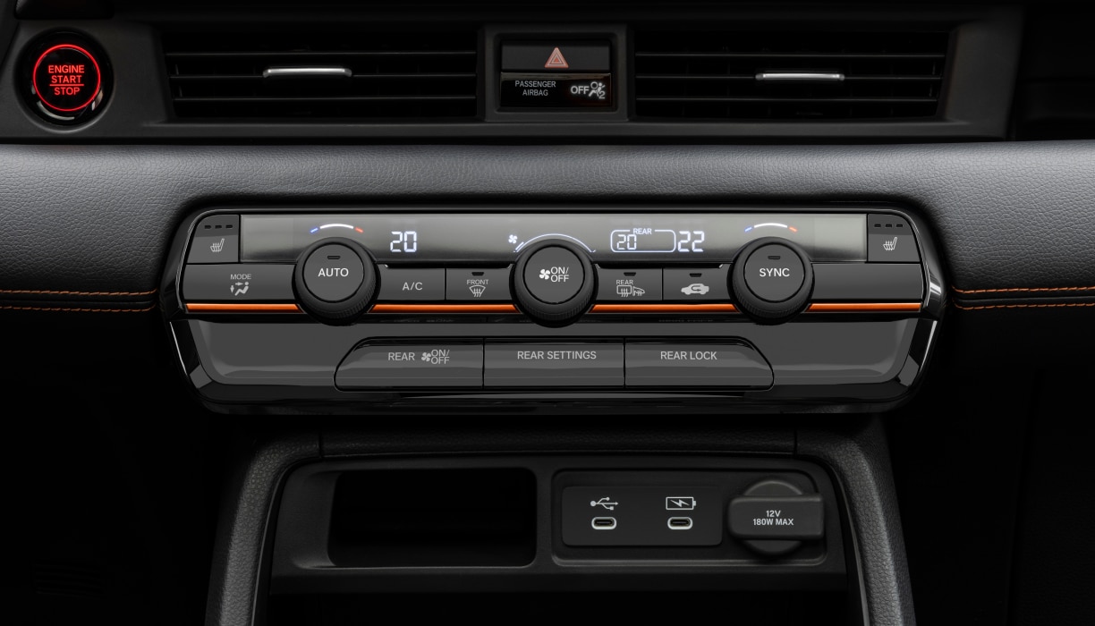 Closeup of the Pilot’s climate control panel, with buttons and dials for temperature adjustment.