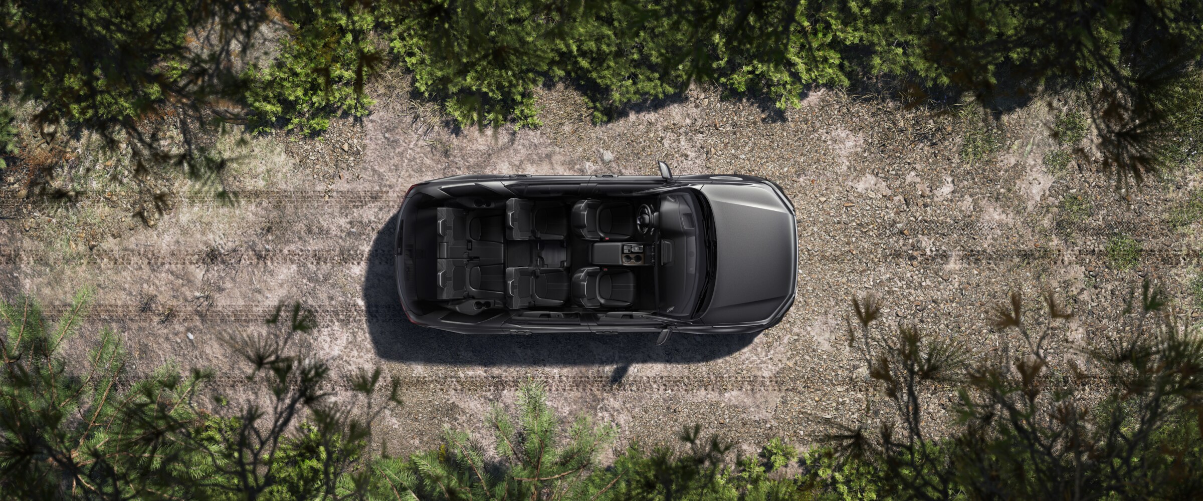 Vue de dessus d’un Pilot gris dont le toit a été enlevé, révélant la disposition des sièges pour sept personnes.