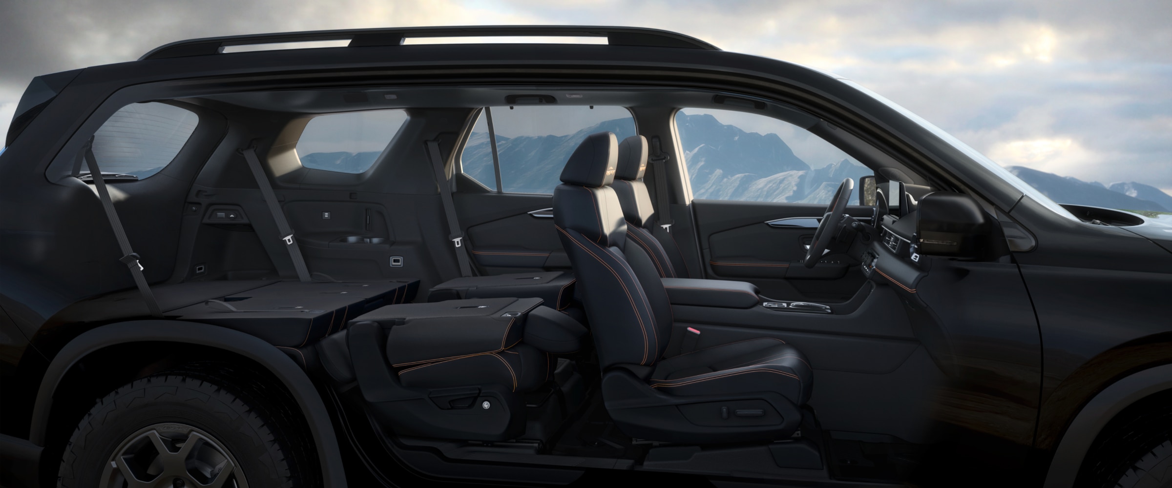 Side view of a Pilot with its doors removed, revealing the interior with the back two rows of seats folded down.