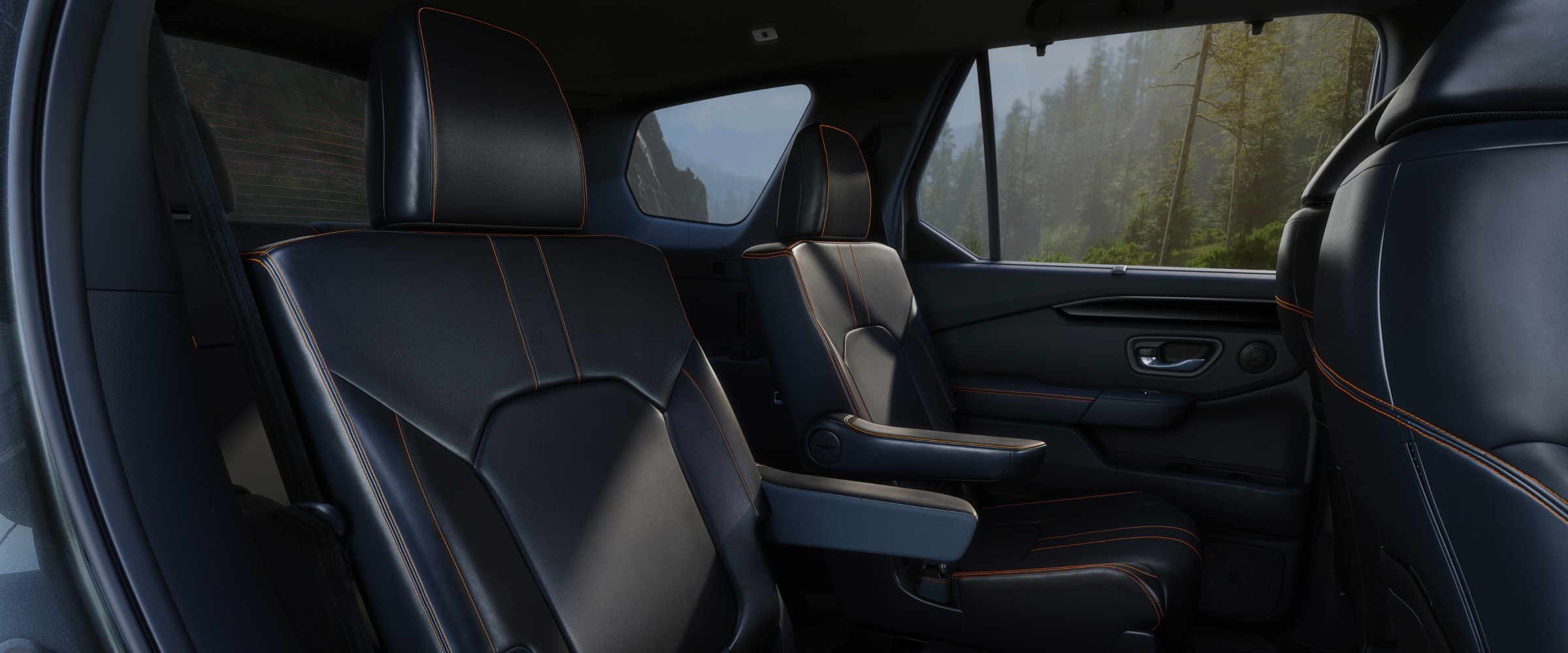 Interior view of the Pilot's second row with two captain's chairs, as seen from the passenger-side door.