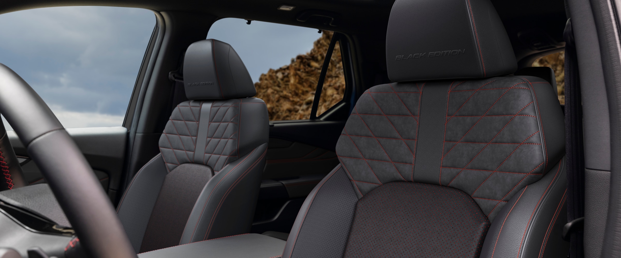 Interior view of the Pilot Black Edition's front-row seats, with "Black Edition" embossed on the black leather.