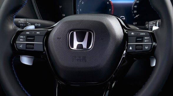 Closeup of Prelude steering wheel with integrated controls. 