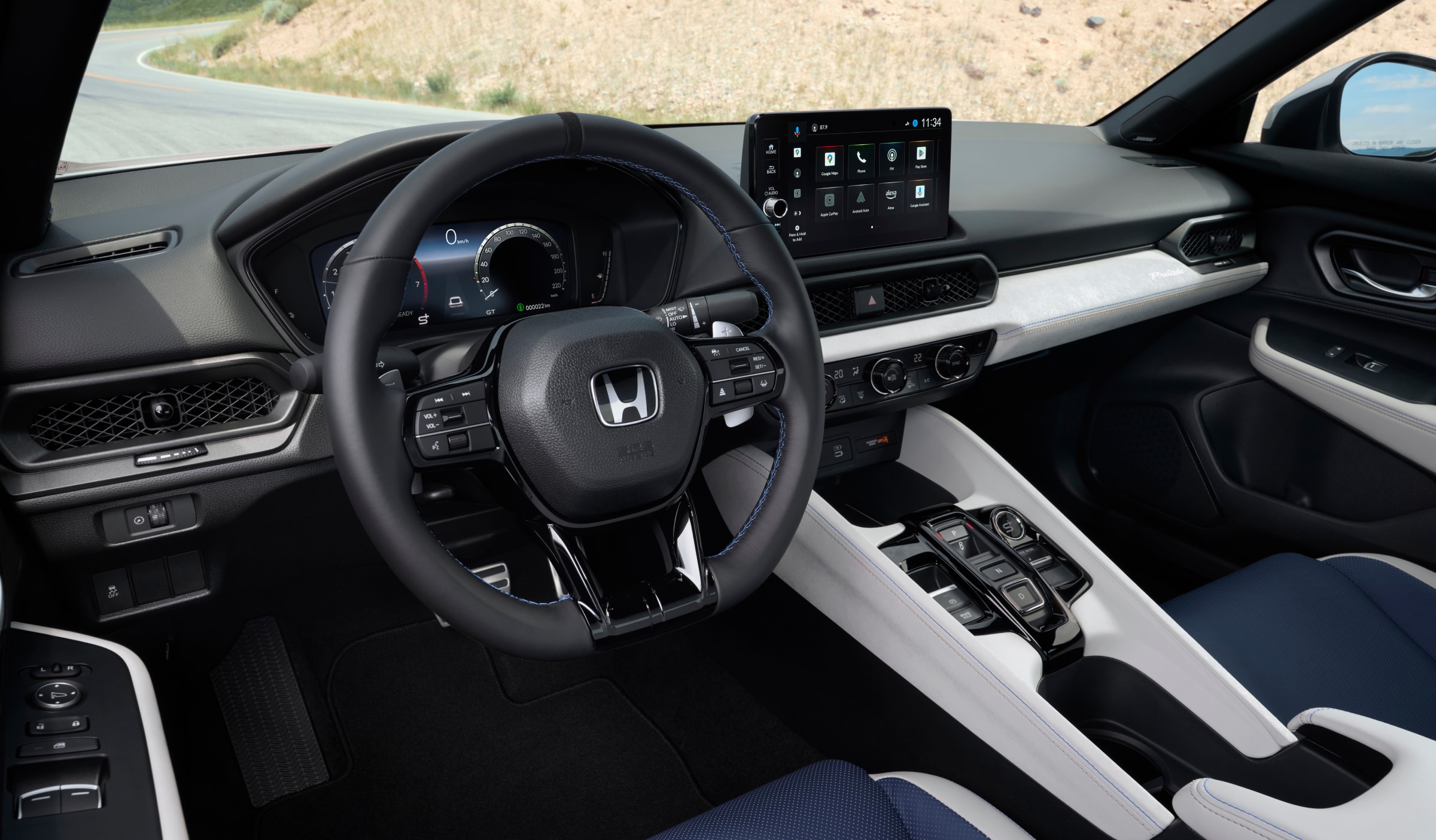Driver's side view of the steering wheel and dashboard.
