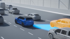 Computer-generated illustration with a 3/4 rear view of a blue Prologue on a highway. Blue sensor waves emit from the back right, detecting a car in the Prologue’s blind spot.