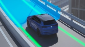 Computer-generated illustration with a 3/4 rear bird’s eye view of a blue Prologue on a highway overpass. Blue sensor waves emit from the front, detecting the lane lines.