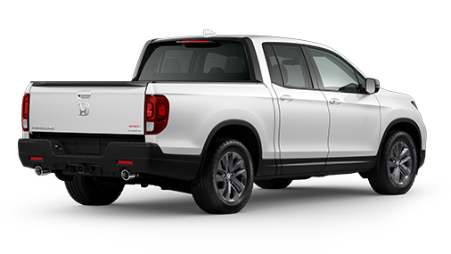 ¾ driver side rear facing view of 2023 Ridgeline Touring model in Platinum White Pearl colour