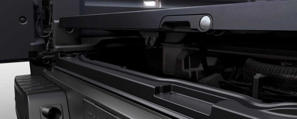 Closeup of lockable In-Bed Trunk slightly ajar.