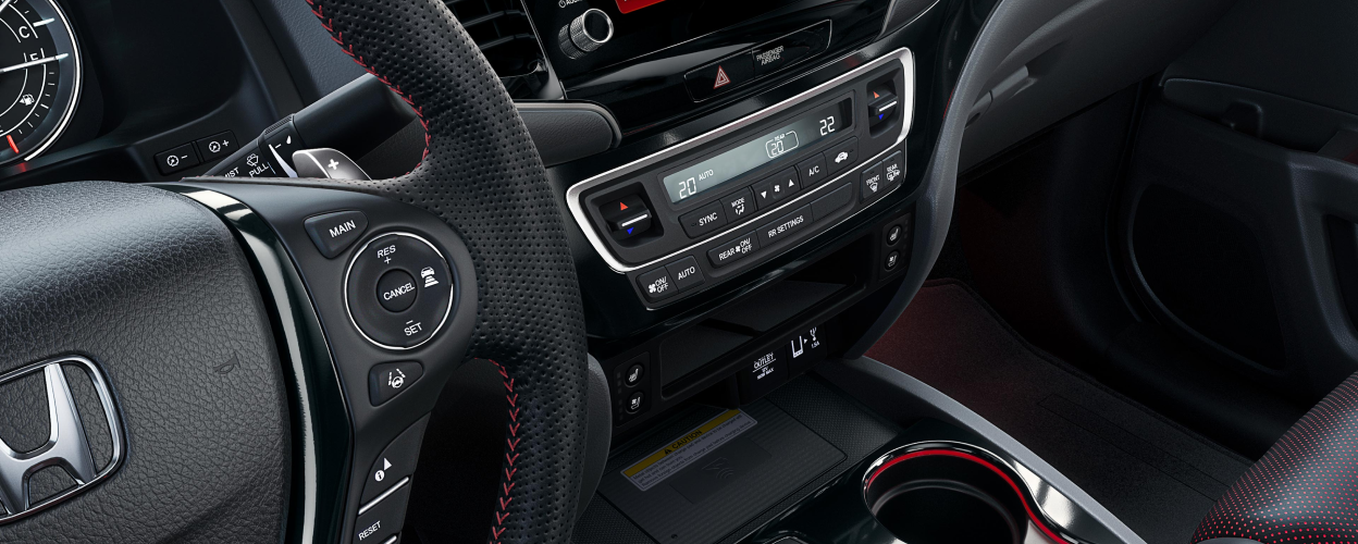 View of the centre console and wireless charging pad.