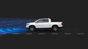 Side view of white Ridgeline in black CGI space. Blue sensor waves and lines emit from the front.