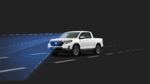 3/4 front view of white Ridgeline in black CGI space. Blue sensor waves and lines emit from the front.