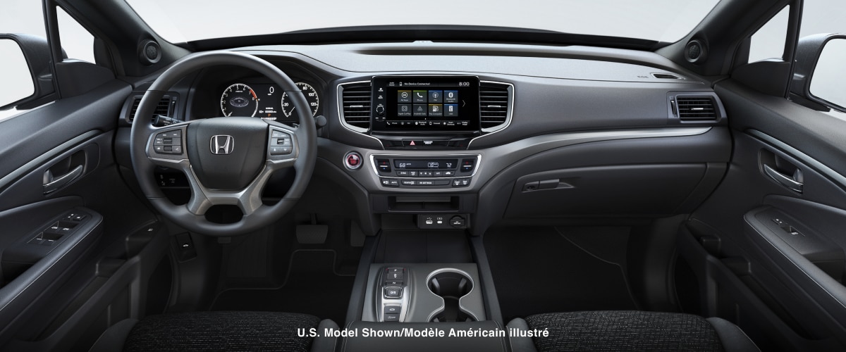 Panoramic interior view of the steering wheel/dashboard/front console of Ridgeline.