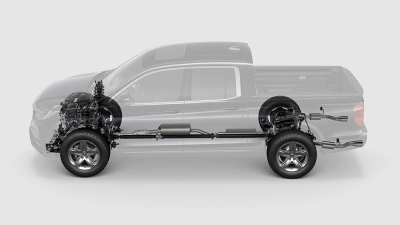 Side view of translucent Ridgeline on white space, showcasing the tires, breaking system, motor, and part of the chassis.