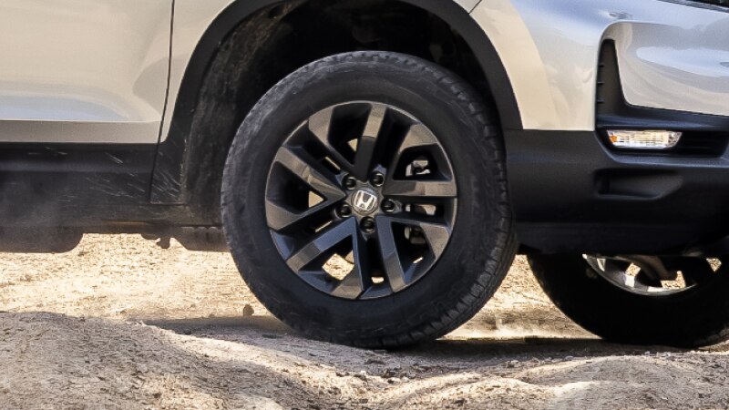 Closeup of black aluminum-alloy wheel on Ridgeline.