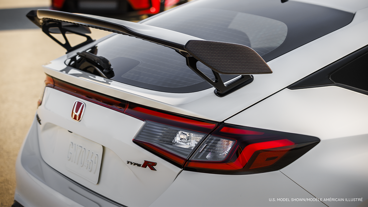 3/4 closeup of white Type R’s rear wing spoiler.