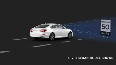 3/4 rear view of white Civic Sedan. Blue sensor waves and lines emit from the front, detecting a traffic sign. 