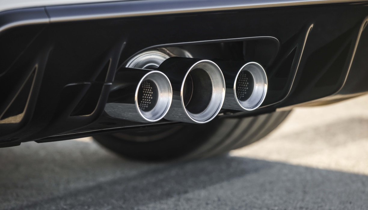 Closeup of triple exhaust feature on a Honda Type ‘R’ vehicle.