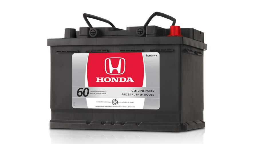 Studio shot of a genuine Acura car battery. // Une photo en studio d'une batterie de voiture Acura d’origine . 	