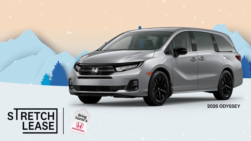 A silver 2026 Odyssey Sport-L with snowy mountains and trees in the background.