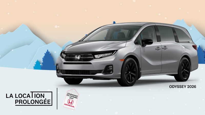 Une Odyssey Sport-L 2026 de couleur argent avec des montagnes enneigées et des arbres en arrière-plan.