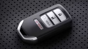 Closeup of Key FOB on perforated seat.