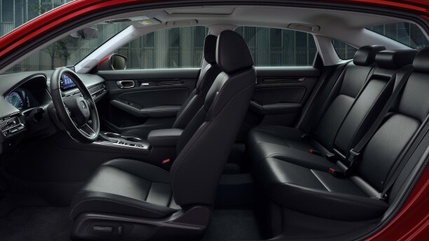 Side panoramic view of a Civic Sedan’s front and rear seats.