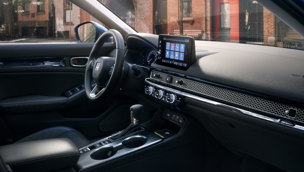 Interior shot of the cockpit in a 2022 Honda Civic from the passenger side point of view.