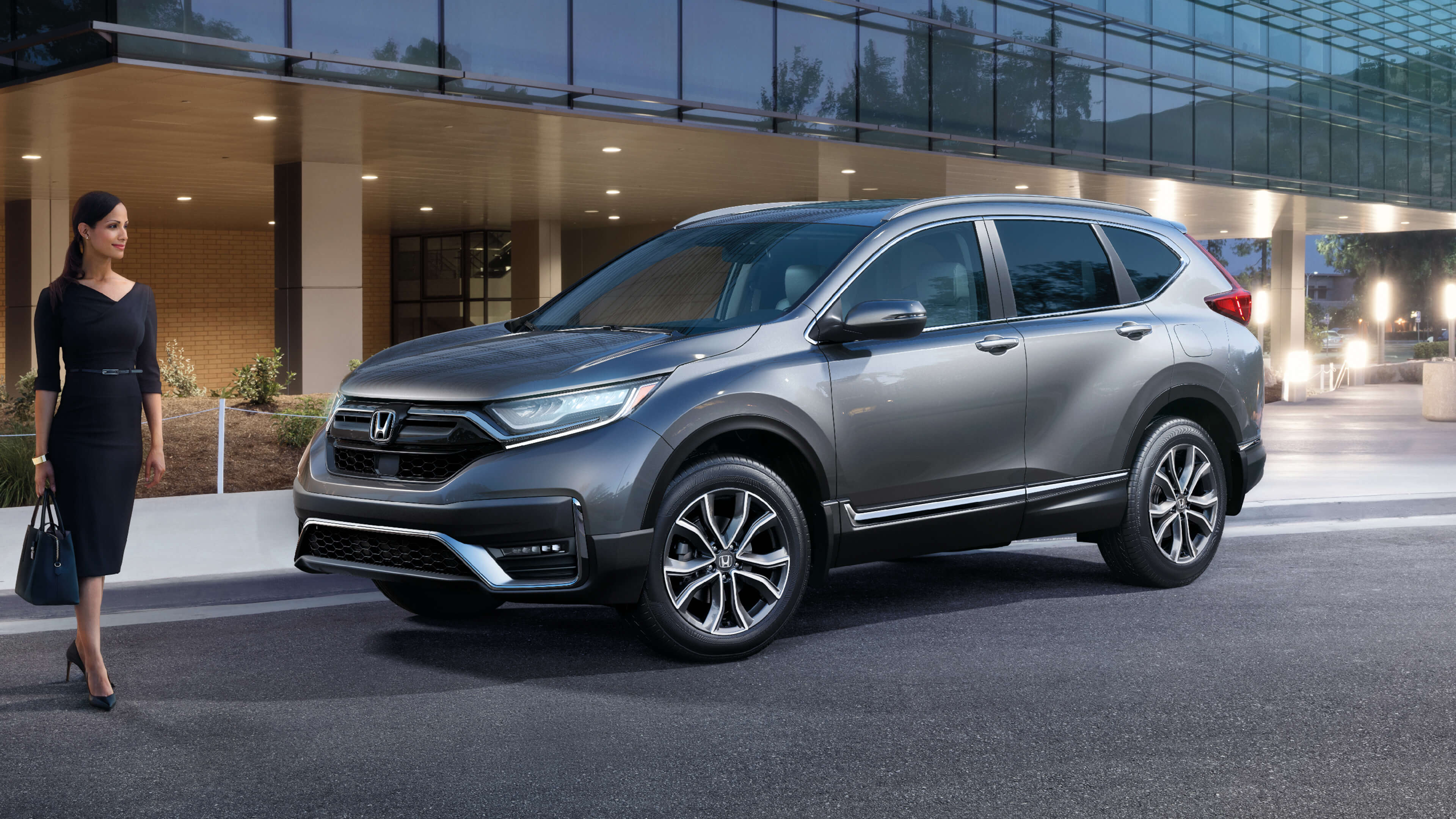 Front 3/4 driver-side view of 2021 Honda CR-V Touring in Modern Steel Metallic.