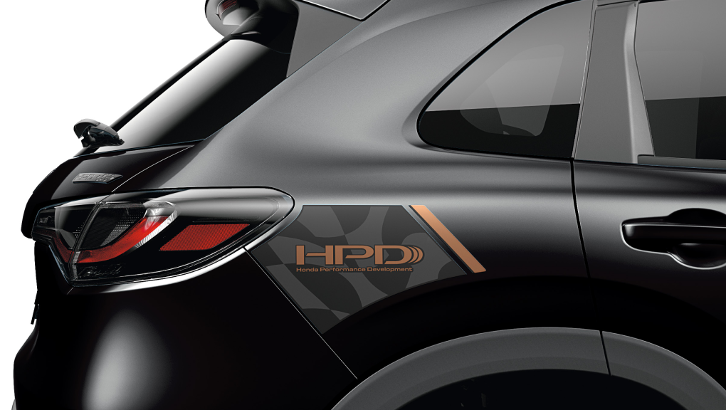 Closeup of HPD™ graphic decal on the back, side of a black HR-V.  