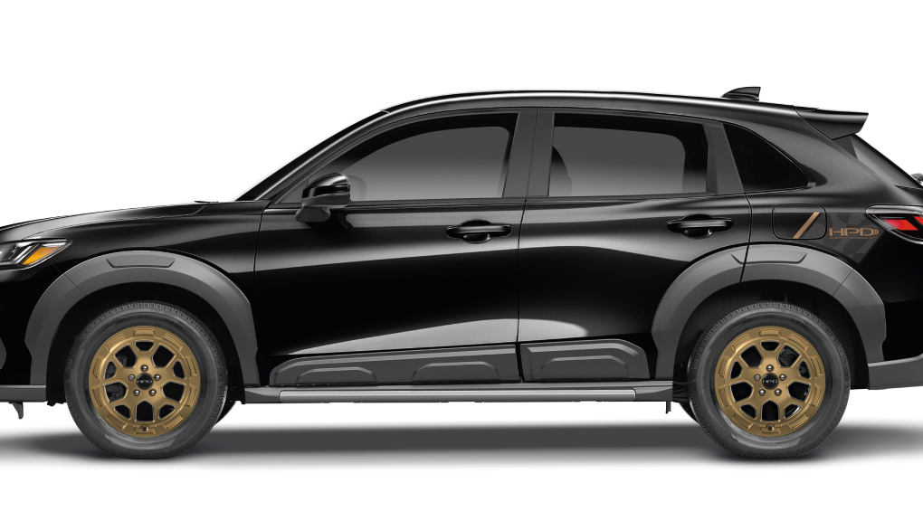 Sideview of black HR-V with showcasing its grey fender flares. 