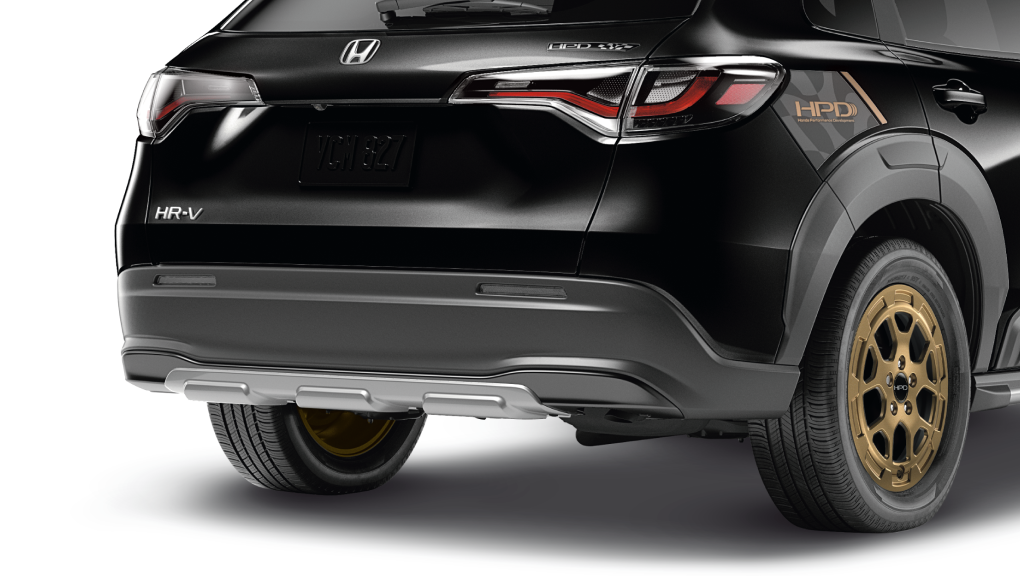 Closeup of the grey rear lower trim on the back of a black HR-V.