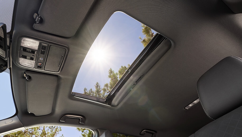 Low angle view of 2021 Honda Passport’s open one-touch power moonroof with tilt feature.